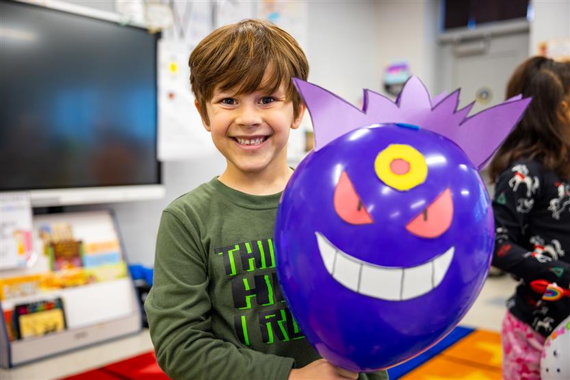 Students participate in a balloon parade